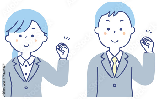 ガッツポーズをするスーツの男女