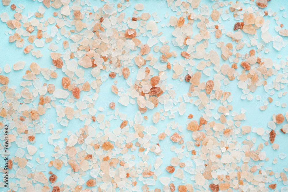 Himalayan pink salt on blue background Himalayan pink salt on blue background