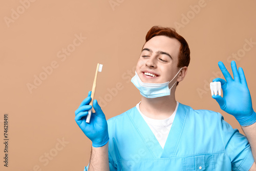 Male dentist with toothbrus...