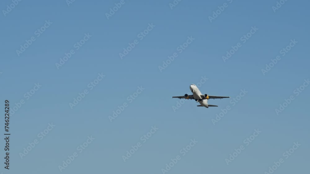 Airplane fly away though the blue sky. Large passenger airplane is taking off against the skies. Airliner landing on landing strip at airport Airplane fly away though the blue sky. Large passenger airplane is taking off against the skies. Airliner landing on landing strip at airport