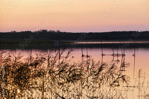 Fototapeta Naklejka Na Ścianę i Meble -  Sunset at lake in rural Masuria, Poland
