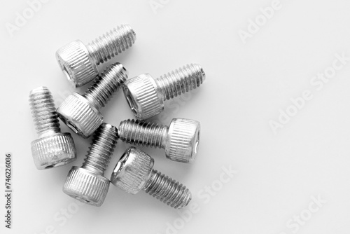 Obraz na płótnie Hex socket head cap screw stainless steel allen bolts full thread metric on white table