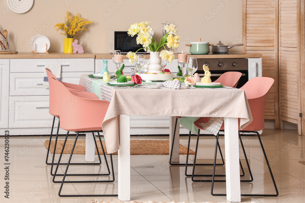 Interior of stylish kitchen with festive Easter table setting