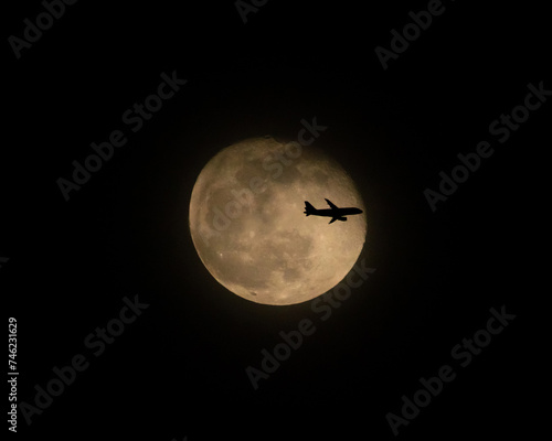 Airliner Crossing a Full Moon at Night (three of three)