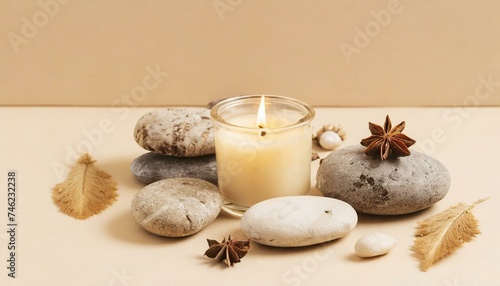 spa still life with candles and towels, Aroma candle on beige background. Warm aesthetic composition with stones. Cozy home comfort, relaxation and wellness concept. Interior decoration mockup