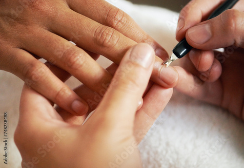 Hands  manicure and cuticle for nails in salon  beauty and treatment to relax. Closeup  spa and tool on fingernail  cleaning and cosmetic service with professional  pamper and luxury for wellness