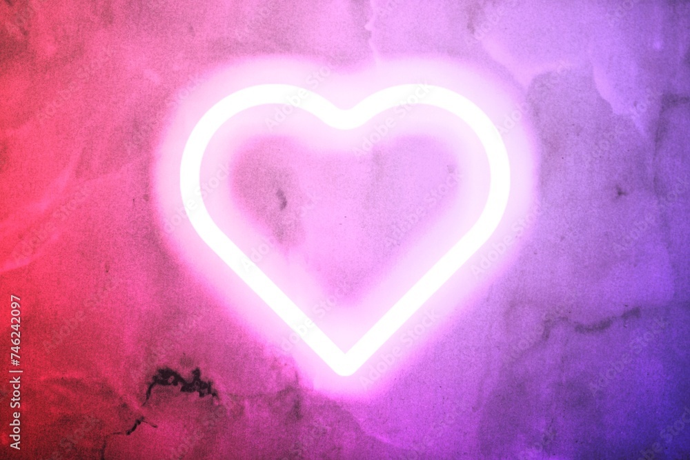 Neon heart glow on the wall background