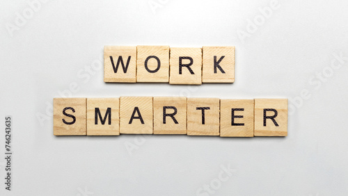 The row of wooden cubes with 'work smarter' text