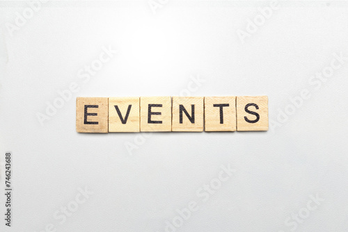 The row of wooden cubes with 'events' text