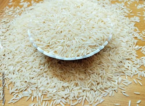 White polished rice cereal grains in a bowl raw whole-rice hulled milled-rice staple food kacha chawal  arroz pulido closeup arroz polido image riz poli image riso lucidato photo photo