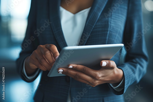 A businesswoman utilizing a tablet, embodying Communication Concepts