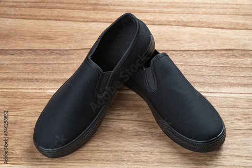 pair of black sneakers for men