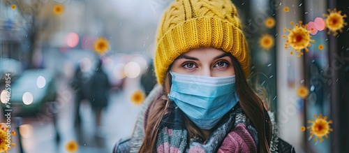 A woman wearing a protective face mask stands in a snowy landscape. The white snow contrasts with the dark clothing and mask, emphasizing safety and protection during winter.