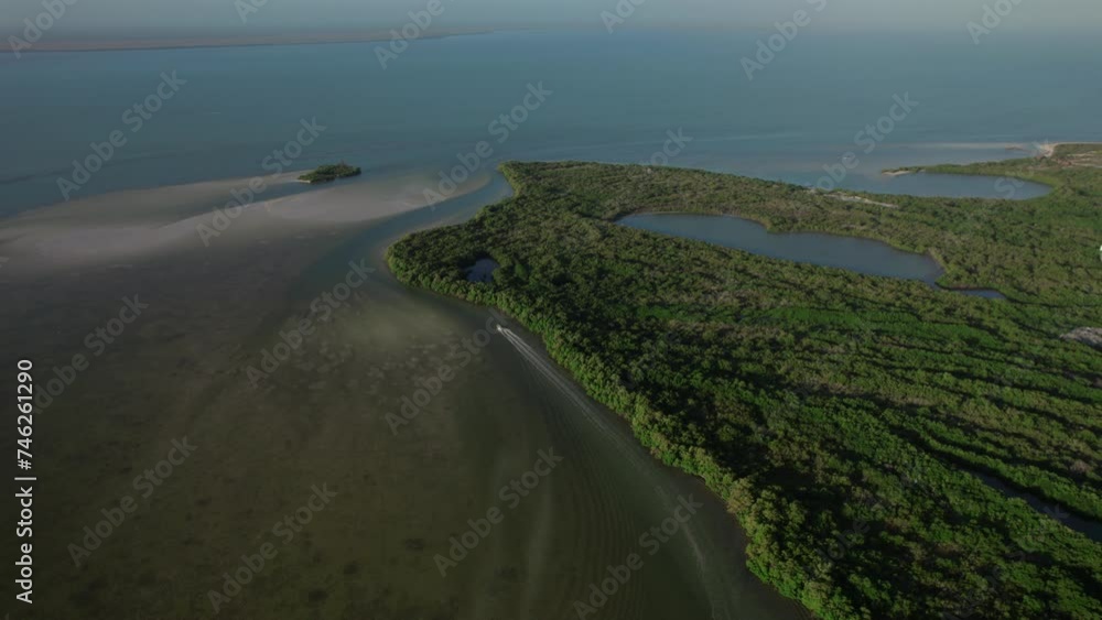 Fast sailing speedboat on the Bioluminiscencia on the island Holbox in Mexico. Drone view Fast sailing speedboat on the Bioluminiscencia on the island Holbox in Mexico. Drone view