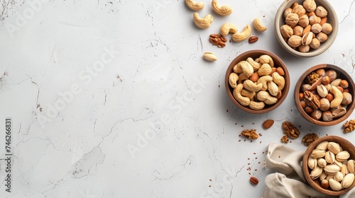 Assorted nuts on a white background, ideal for health food topics, dietary content, and culinary backgrounds.