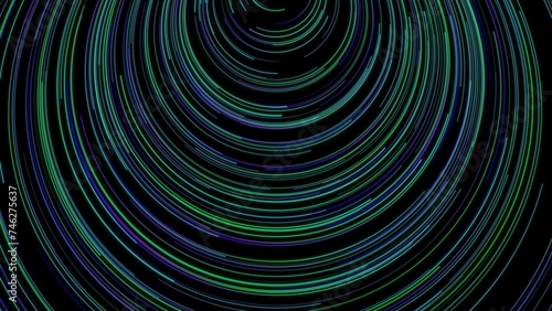 Closeup of a swirling green and blue pattern on a dark background