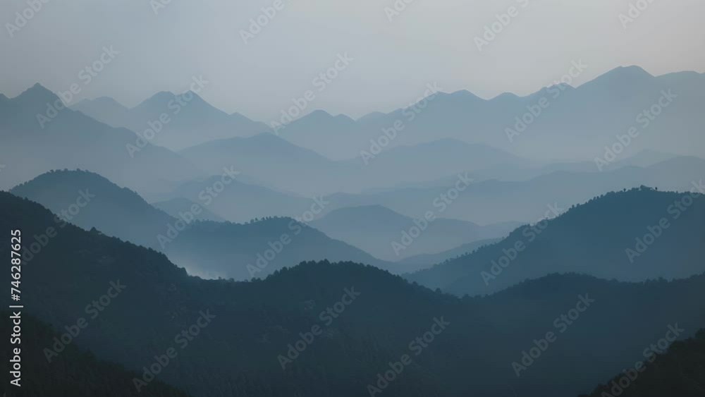 The tranquility of the mountains mirrored in their darkened silhouettes. The tranquility of the mountains mirrored in their darkened silhouettes.