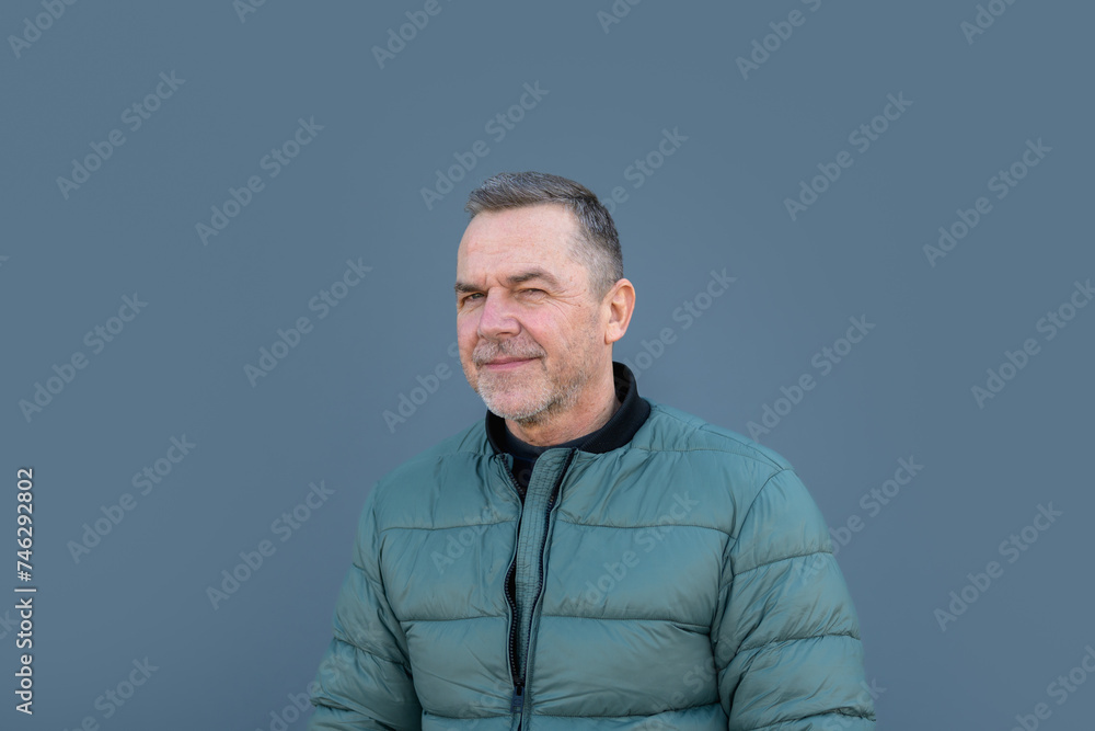 Portrait of a middle aged man looking with a funny look winking Portrait of a middle aged man looking with a funny look winking