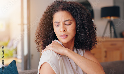 Fotografie Woman, shoulder pain and injury in home with stress, thinking and hand for massage for relief