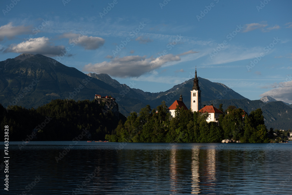 Lake Bled church and castle on a sunny day in Slovenia