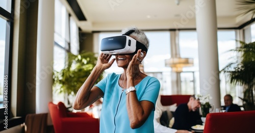 Elderly women explore virtual reality in a sunlit living room, showcasing amazement and engagement with digital innovation