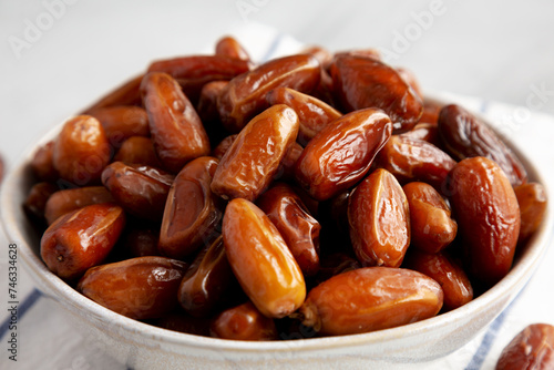 Organic Raw Date Fruit in a Bowl, side view. Close-up.