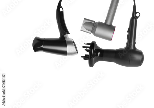 Three different hair dryers on white background