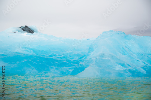 Wallpaper Mural  closeup texture of bright blue iceberg. Enviromental issues, global warming concept Torontodigital.ca