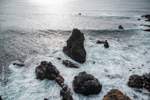 Rocky islandic coast, Waves crashing againt big massive rocks , seascape photo