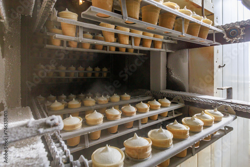 Production of tasty ice cream in the waffle cup.