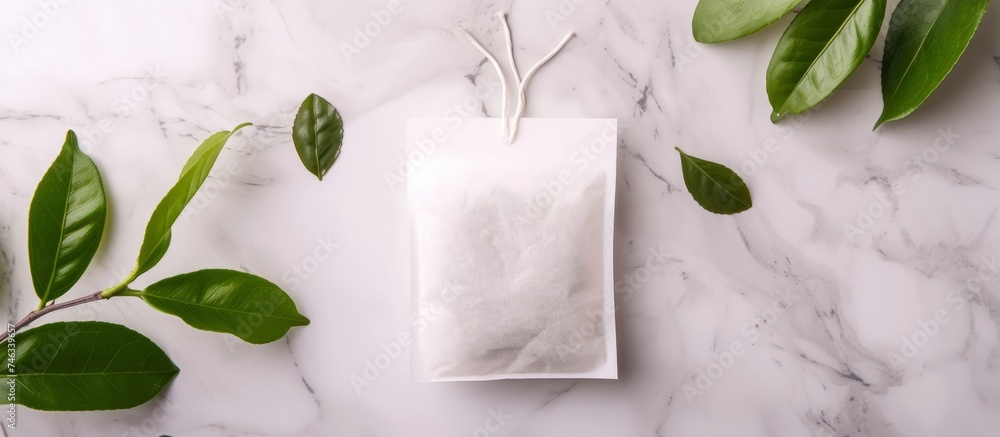 Aromatic tea leaves spilling from a bag onto a luxurious marble surface Aromatic tea leaves spilling from a bag onto a luxurious marble surface