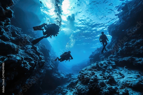 Scuba Diving Men in Blue Water, Diving in the Great Barrier Reef, Tropical Divers, Deep Underwater © artemstepanov