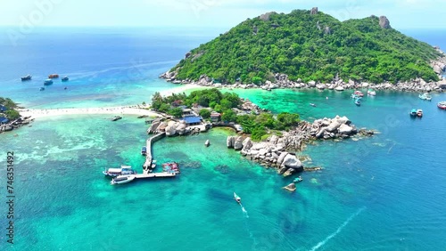 Explore a secluded island boasting a unique powdery sandbar, inviting you to snorkel amidst colorful marine creatures and relax under the sun. Ko Nangyuan, Surat Thani Province, Southern Thailand.
 photo