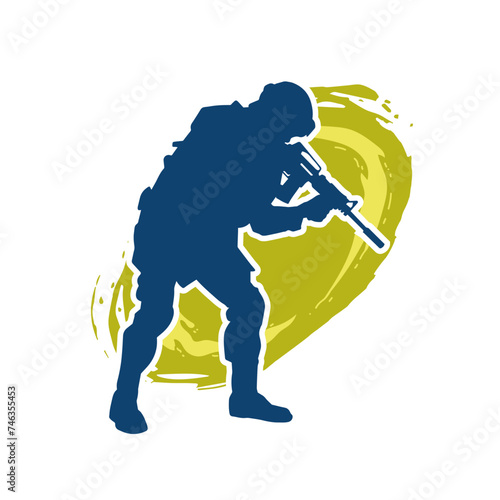 Silhouette of a male soldier carrying machine gun weapon.