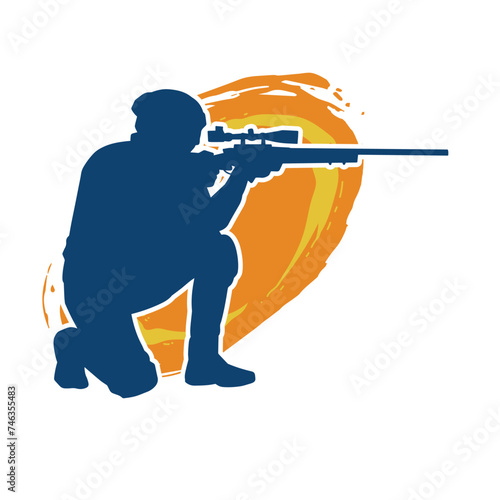 Silhouette of a male shooter firing sniper long barrel riffle gun weapon