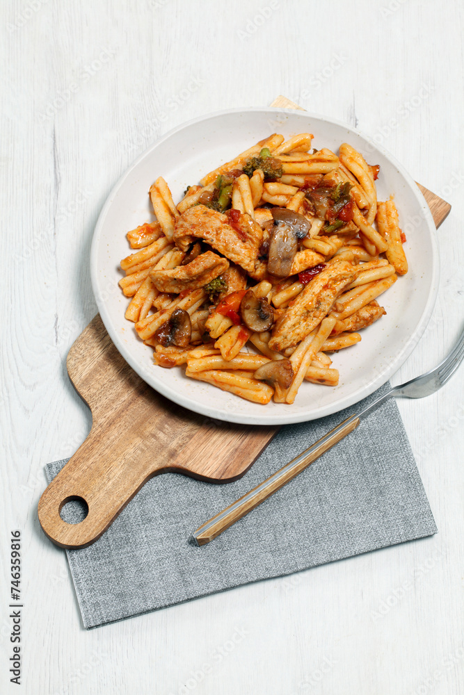 Pasta dish with tomato chicken and broccoli Pasta dish with tomato chicken and broccoli
