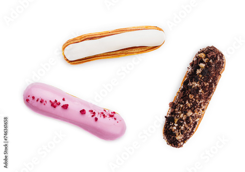 three different types of French eclairs on a white plate isolated on white background