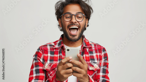 Smiling Indian man showing gestures of approval and satisfaction, concept of happiness, excitement when receiving lottery prize or joyful events communicated mobile phone. Generative Ai Illustration. photo