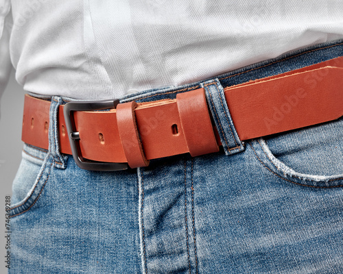 Man in casual attire with custom embossed terracotta leather belt