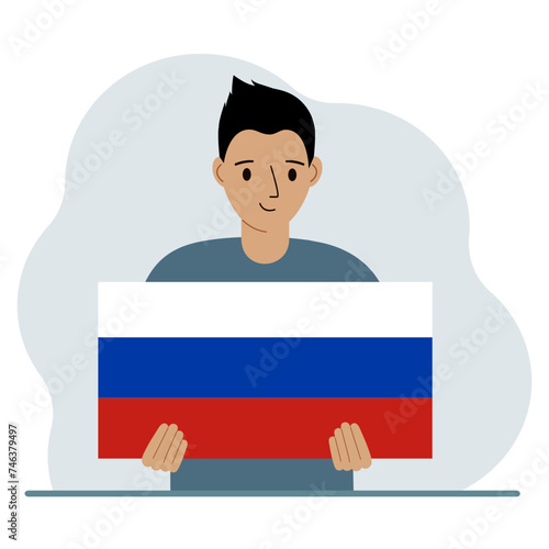 A man holds a Russian flag in his hands. The concept of demonstration, national holiday or patriotism. Nationality.
