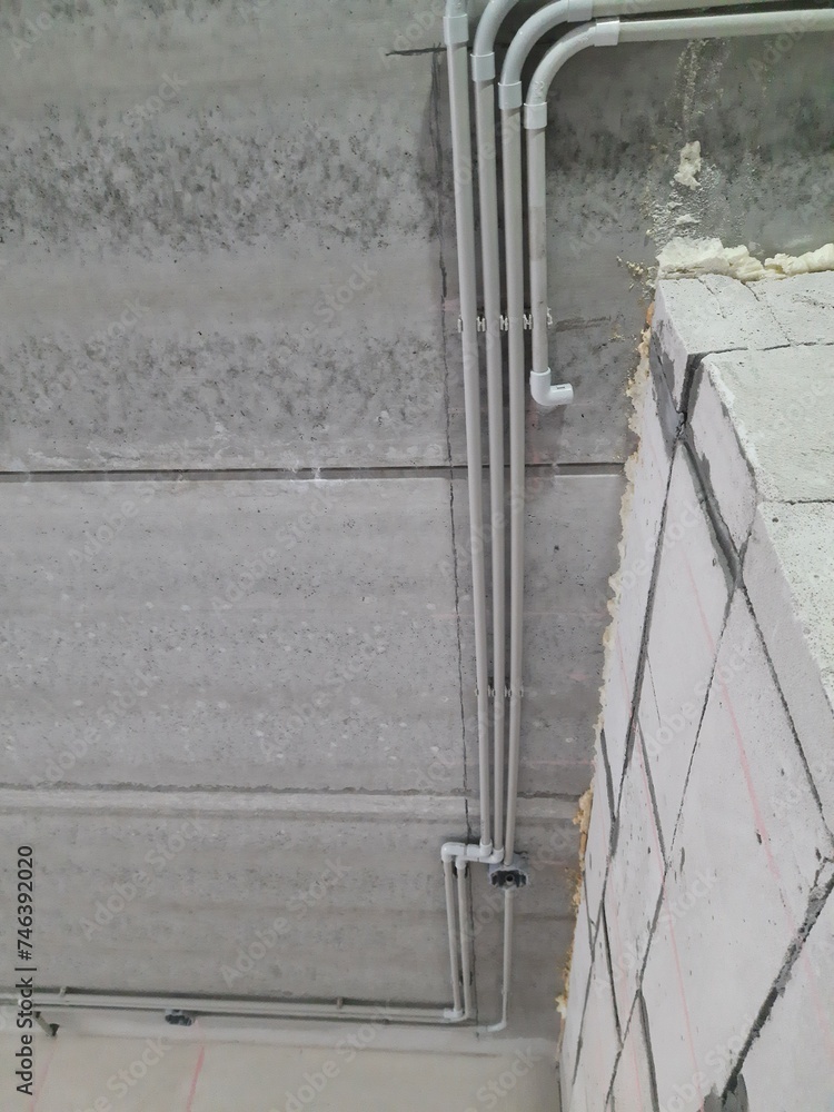 Installation of plastic pipes for the electrical network. StockFoto Adobe Stock