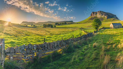 Panoramic green grass field with barn house. © Reem