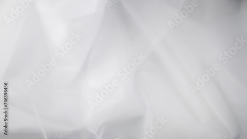 Beautiful layers of delicate light white fabric background. photo