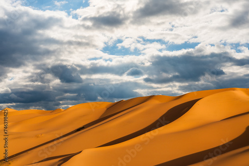Dramatic sunset over the sand dunes in the desert. Gobi desert © Anton Petrus