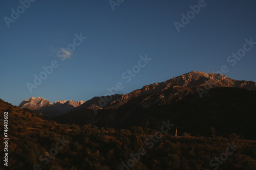 landscape with mountain peaks background the sky with clouds at sunset in autumn