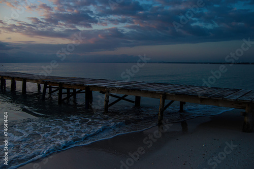 Aerial - Alone Boat Dock in Alcúdia Beach, April 2021. Mallorca Sunrise