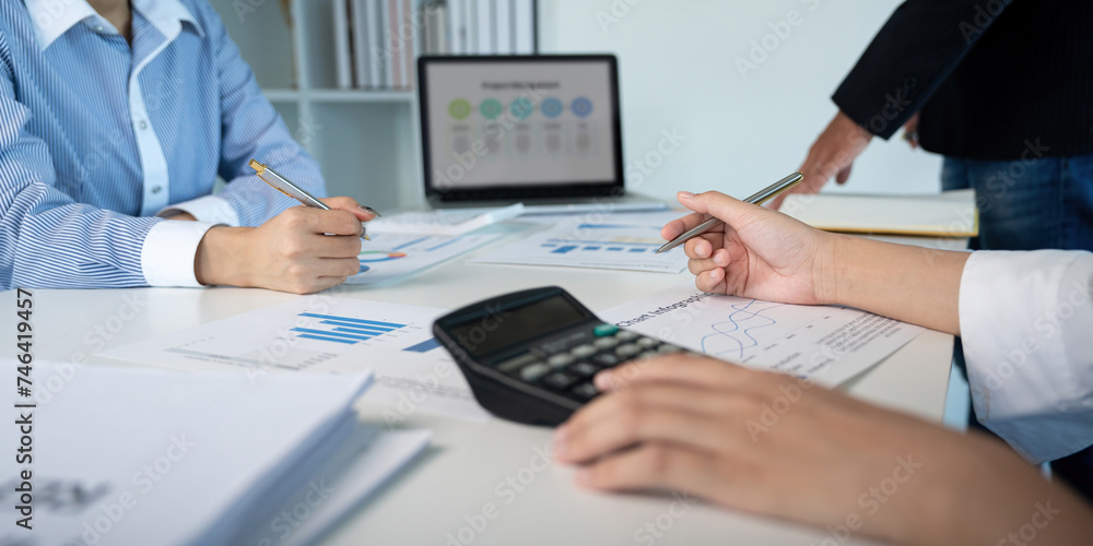 Business team analyzing income chart and graph in office. Close up. Business analysis and strategy concept Business team analyzing income chart and graph in office. Close up. Business analysis and strategy concept