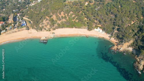 Spectacular drone footage captures the essence of Lloret De Mar's coastal allure and the pristine beauty of Cala Canyelles, set against the backdrop of Costa Brava. photo