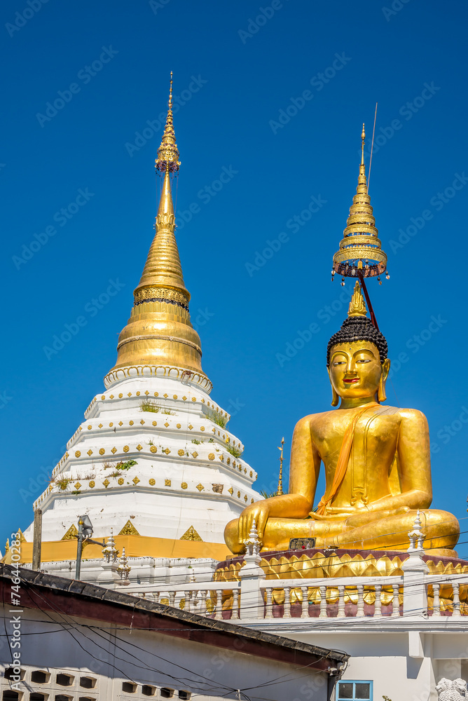 Naklejka premium View at the Big Buddha statue in Wat of Chiang Yuen in the streets of Chiang Mai town - Thailand