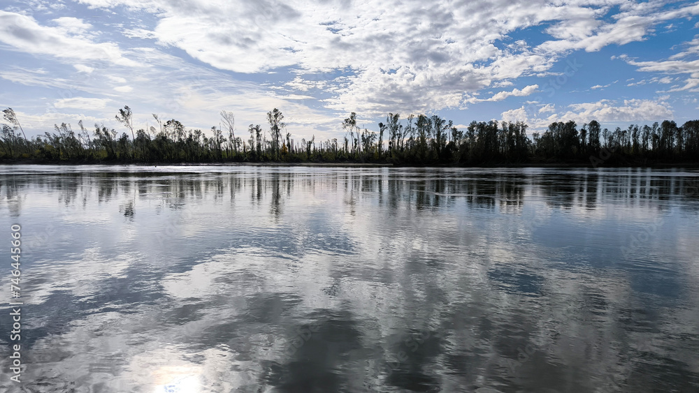 Obraz premium blue sky and white clouds reflected in Danube river in Vojvodina